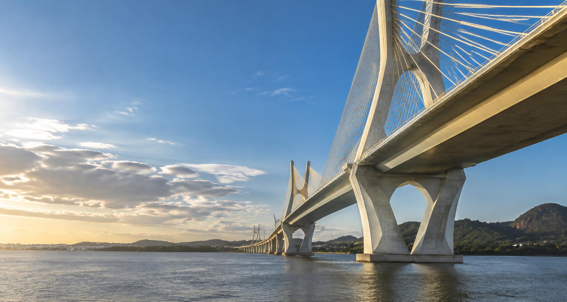 Ponte estaiada com estrutura de concreto e cabos de aço sobre um rio